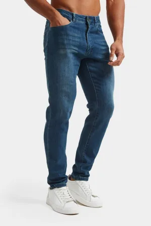 Modern Spring Mood Reliable Layer Athletic Fit Jeans in Mid Blue